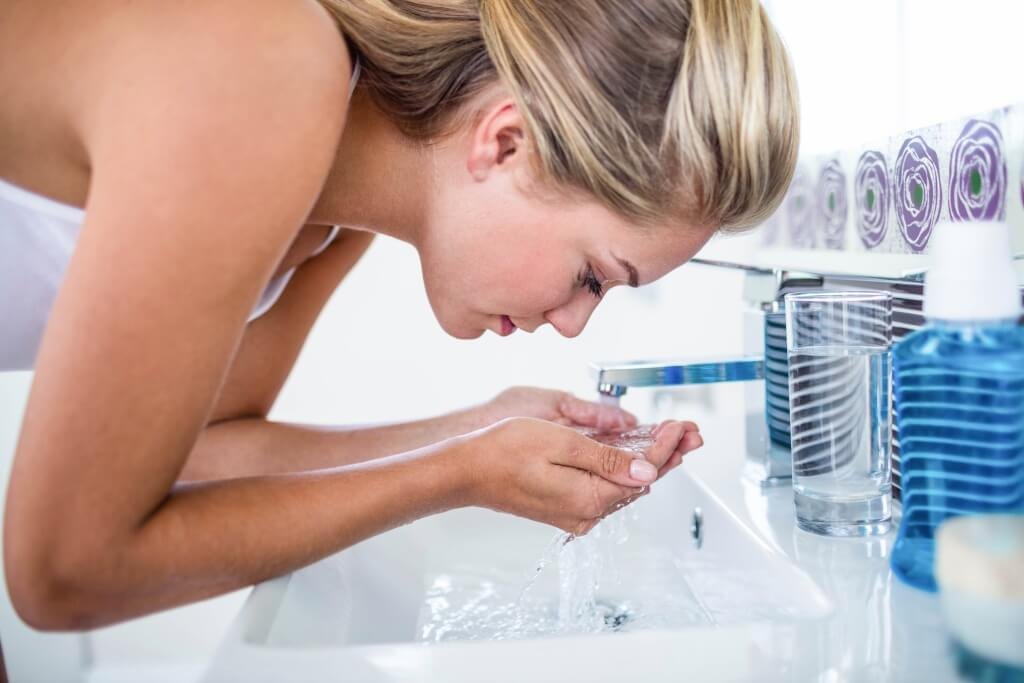 Woman Washing Her Face - Have a Good Skincare Routine for Younger Looking Skin
